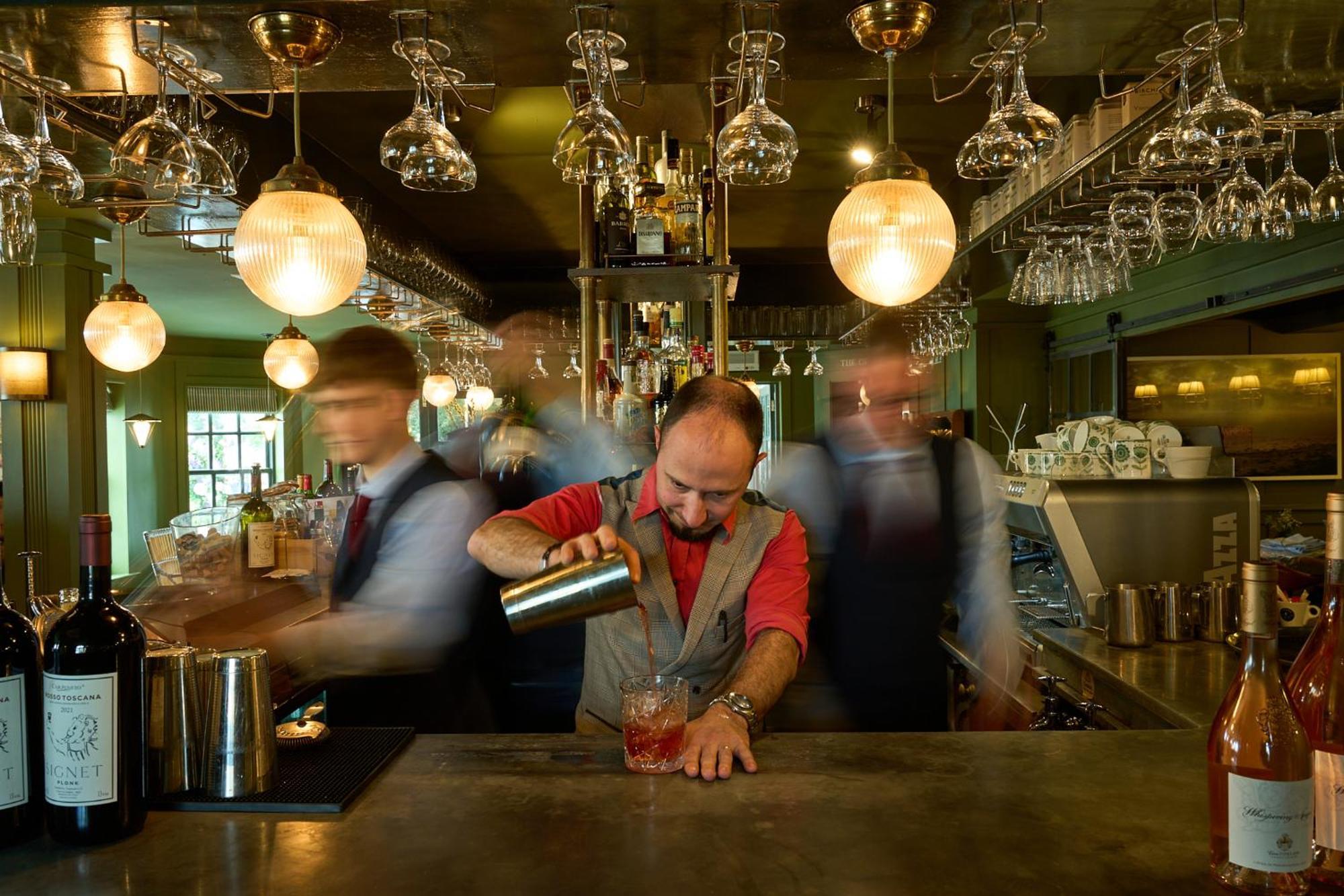 The Mitre, Hampton Court Hotel Kingston upon Thames  Bagian luar foto A bartender at work